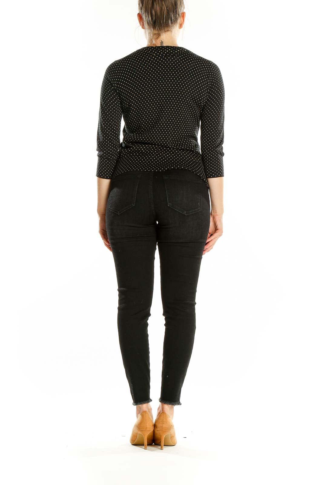 Back view of Banana Republic black polka dot cardigan showing fitted silhouette