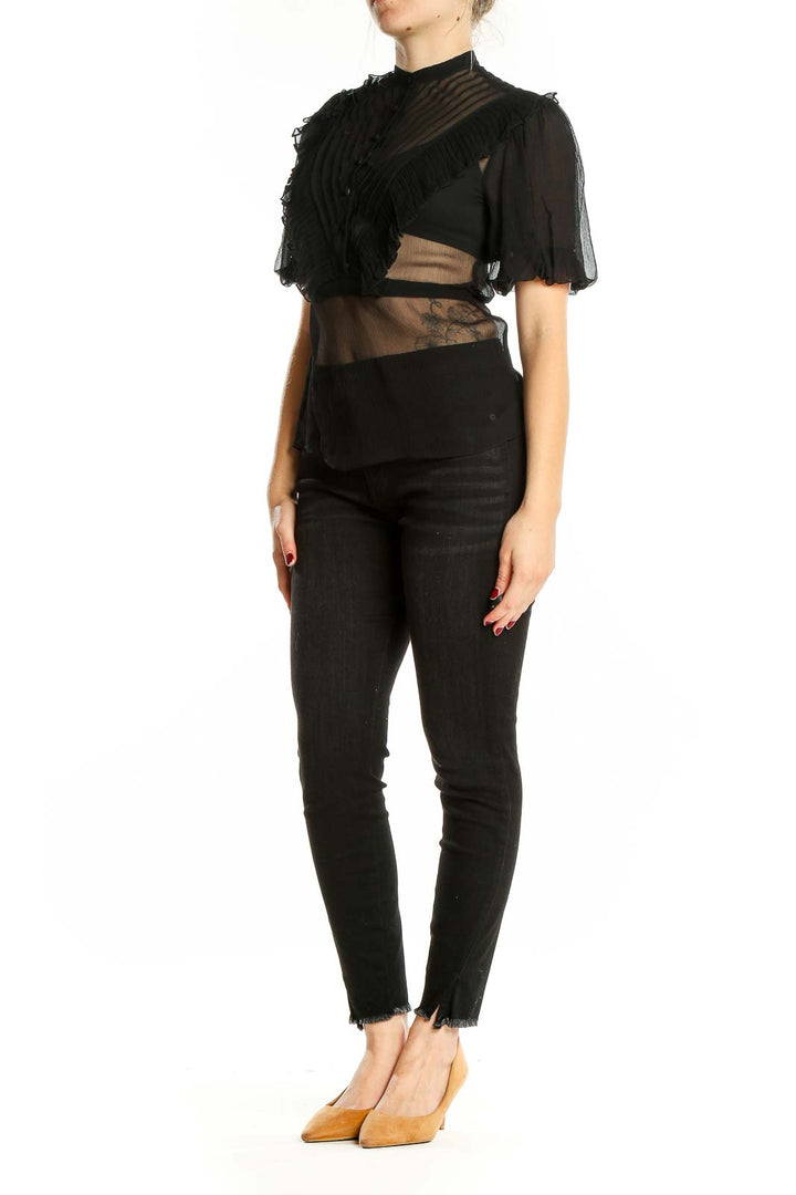 Front view of BCBG MaxAzria black sheer crop top with puff sleeves and striped detailing