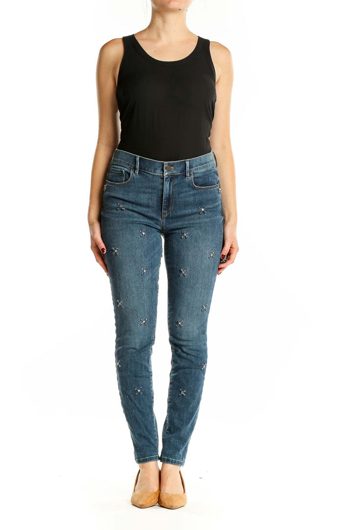 Front view of Ann Taylor blue embellished skinny jeans on model