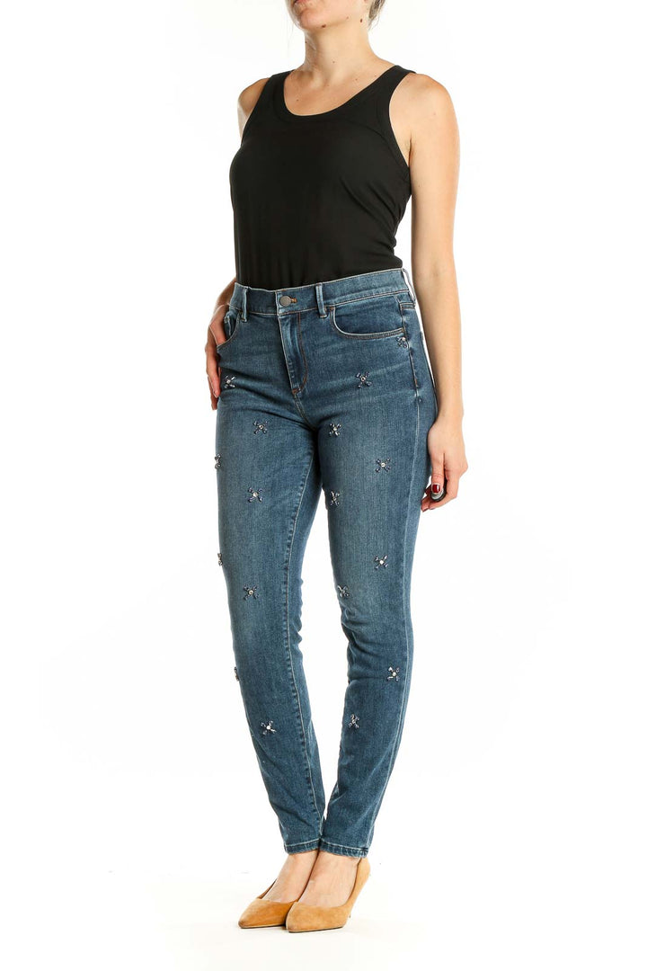 Front view of Ann Taylor blue embellished skinny jeans on model