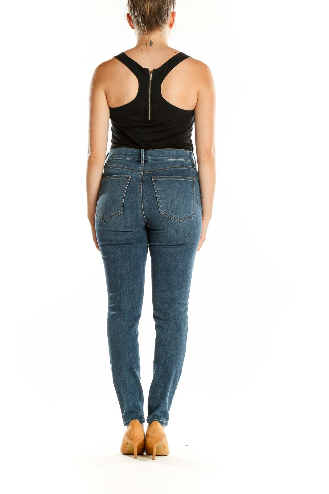 Back view of Ann Taylor blue embellished skinny jeans on model