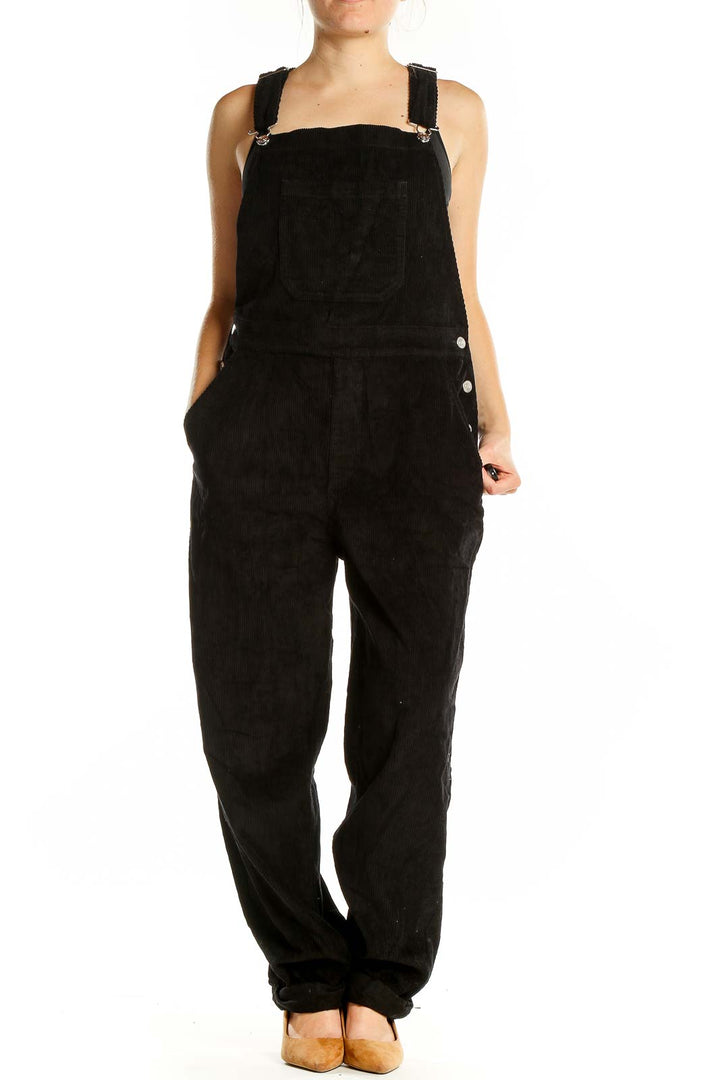 Front view of ASOS black overalls jumpsuit with wide legs and adjustable straps