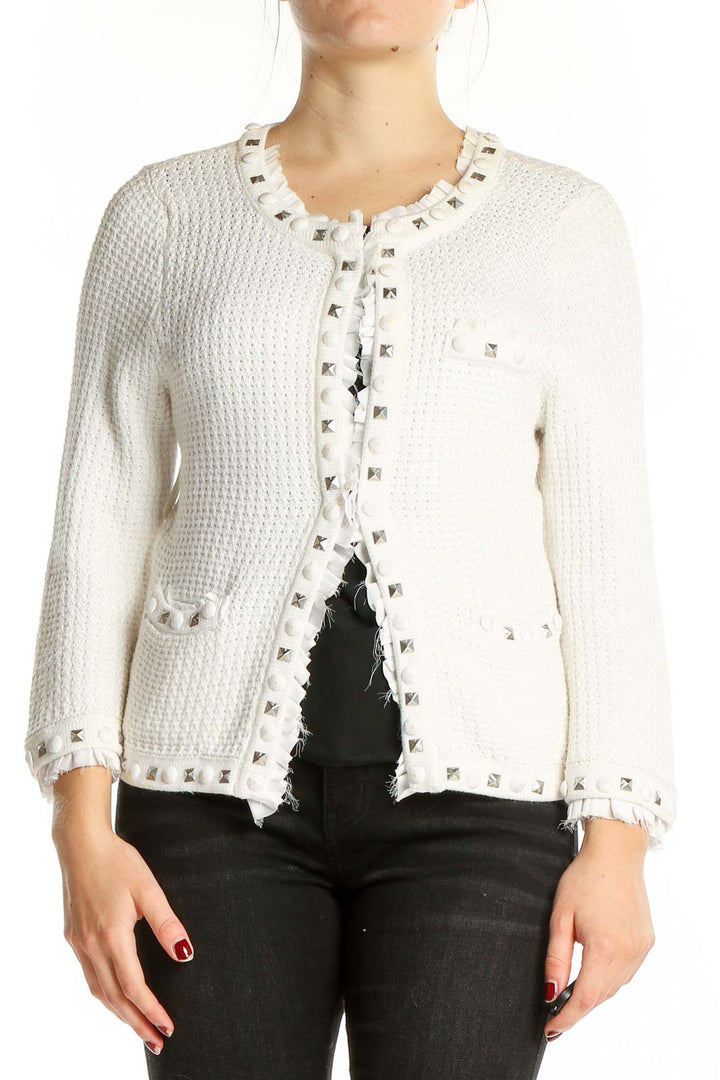 Front view of White House Black Market white knit cardigan with silver studs