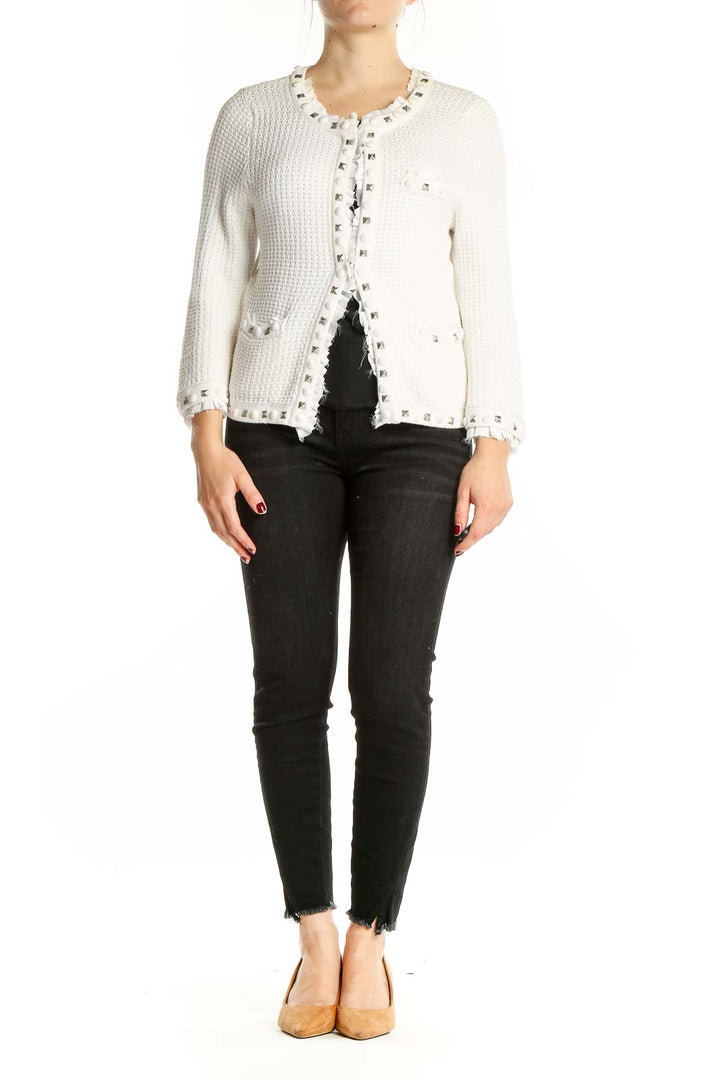 Front view of White House Black Market white knit cardigan with silver studs