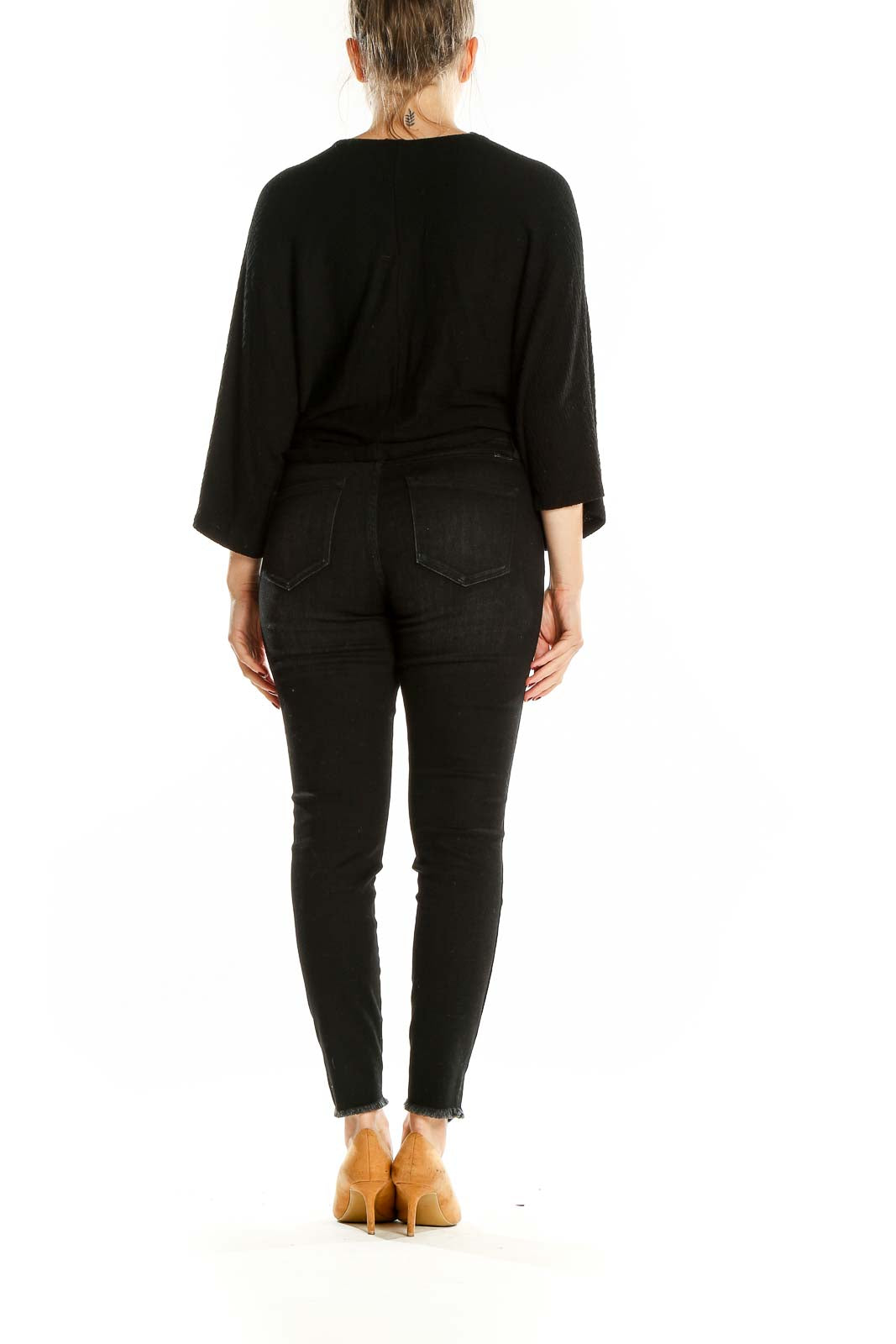 Back view of black Maeve top on model with jeans