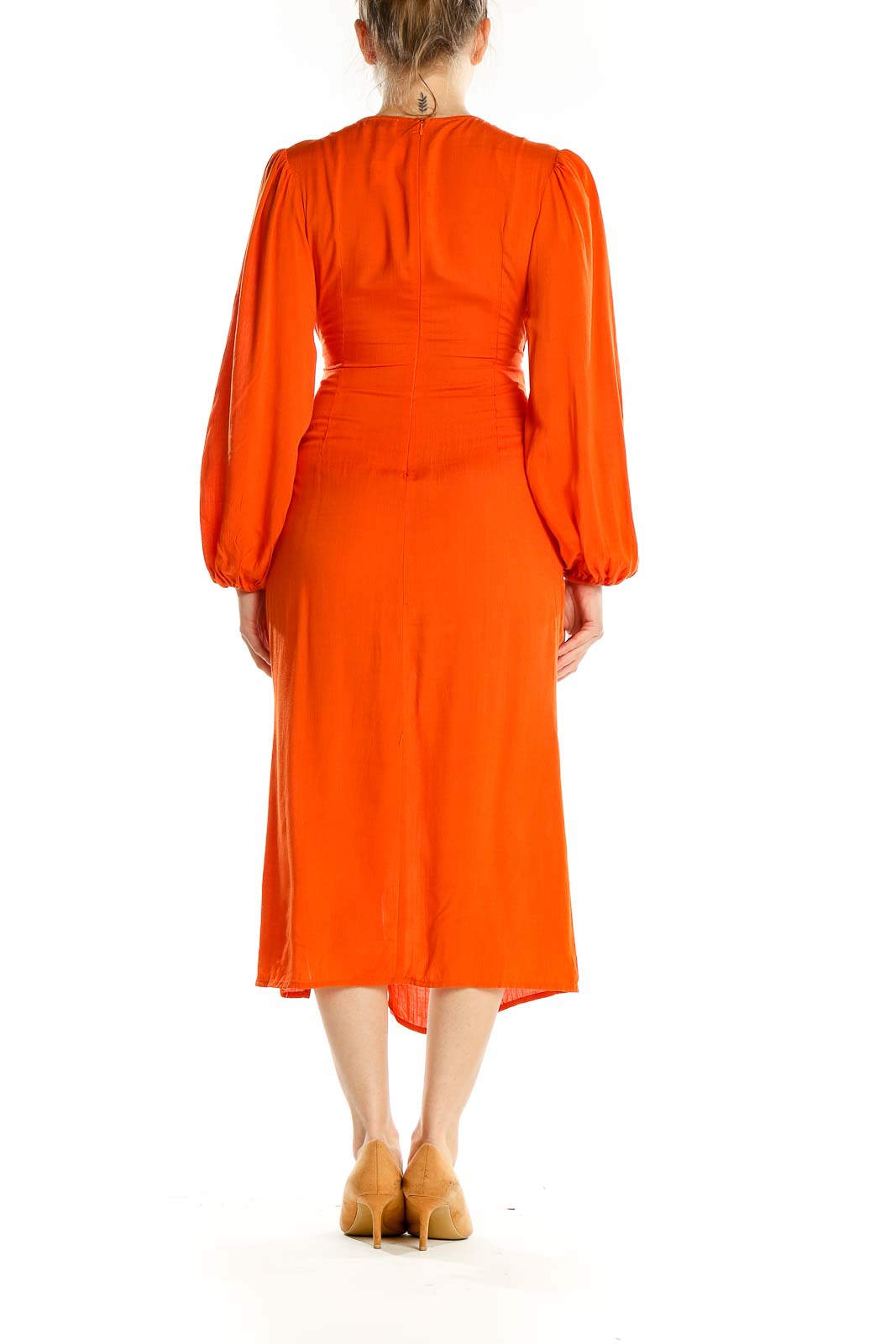 Back view of orange rayon midi dress showing long sleeves and fitted waist