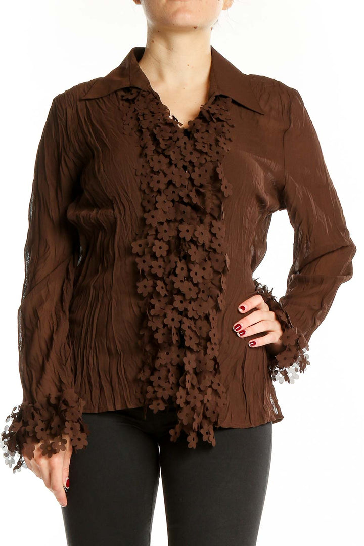 Front view of brown Claudia Richard blouse with floral lace detailing