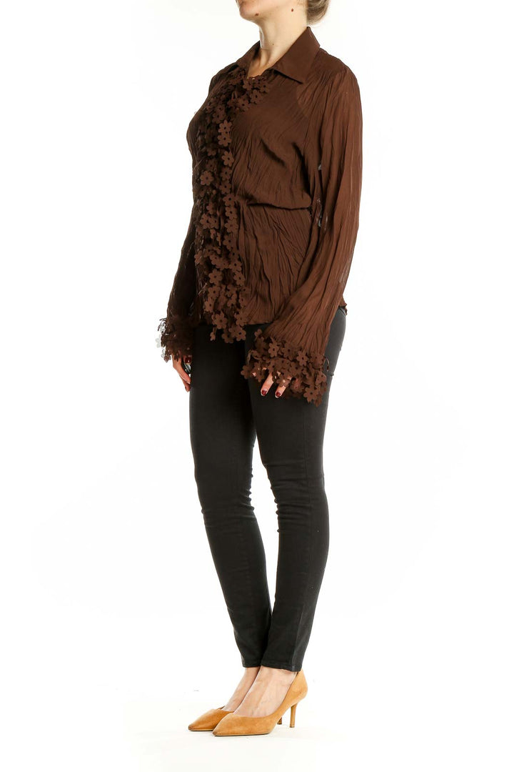 Front view of brown Claudia Richard blouse with floral lace detailing