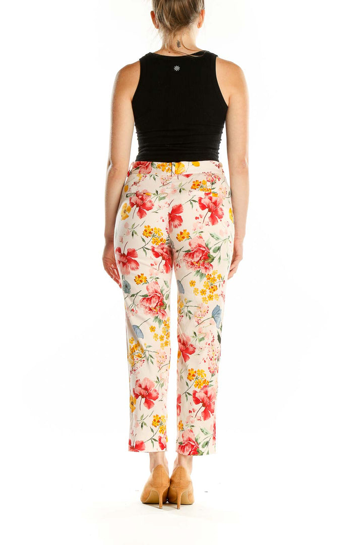 Back view of Zara floral print cropped trousers on model