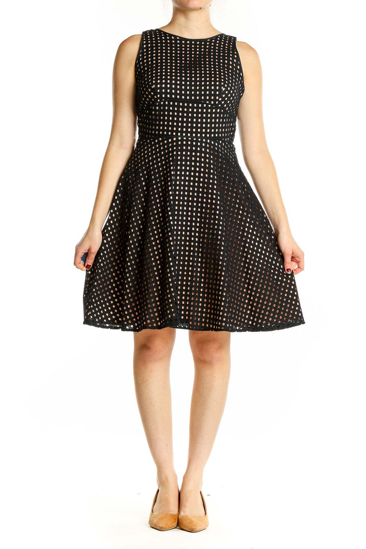 Front view of LOFT black cotton fit-and-flare dress with white polka dots