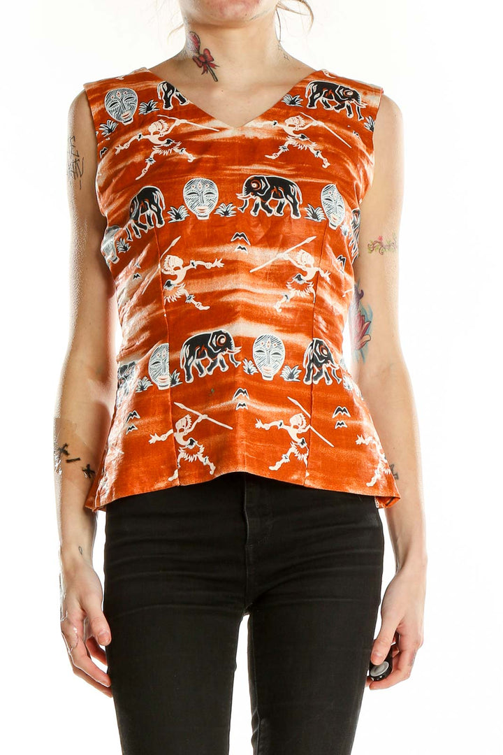 Front view of orange SilkRoll sleeveless top with tribal elephant and mask print