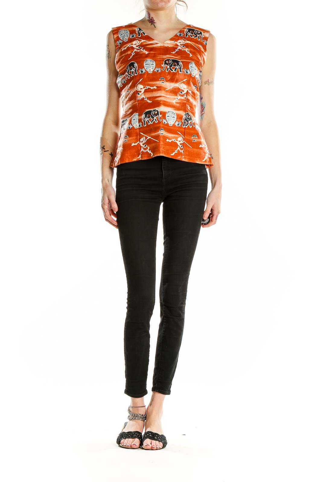 Front view of orange SilkRoll sleeveless top with tribal elephant and mask print