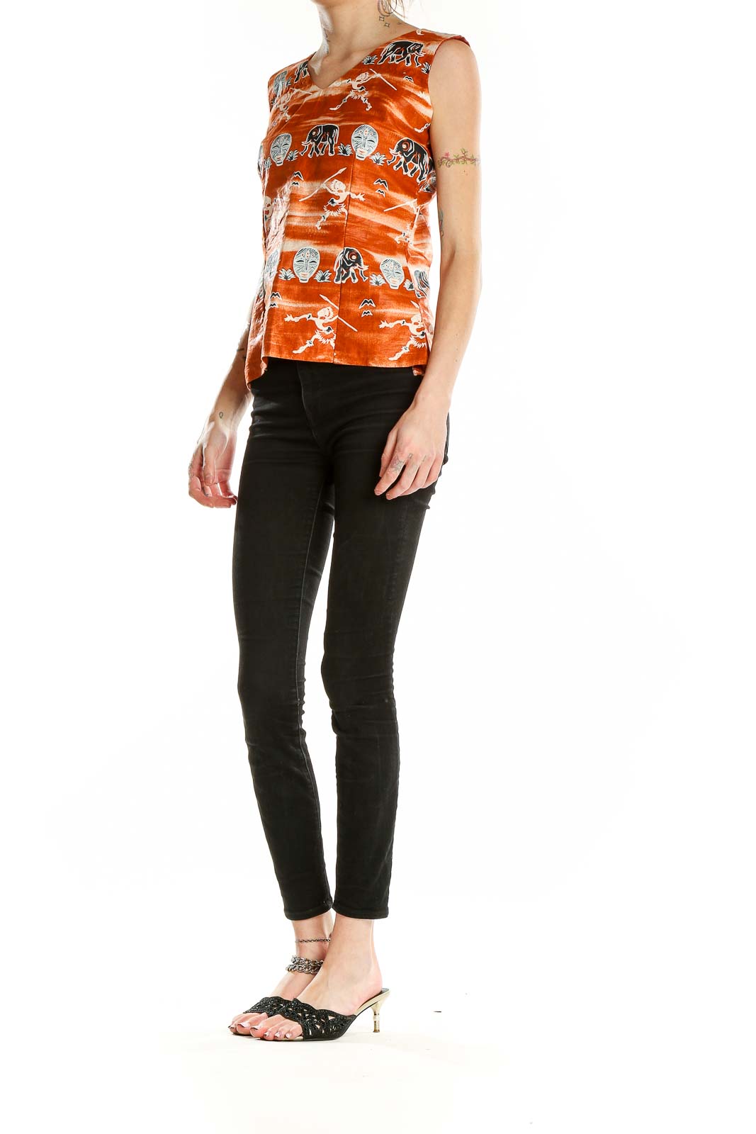 Front view of orange SilkRoll sleeveless top with tribal elephant and mask print