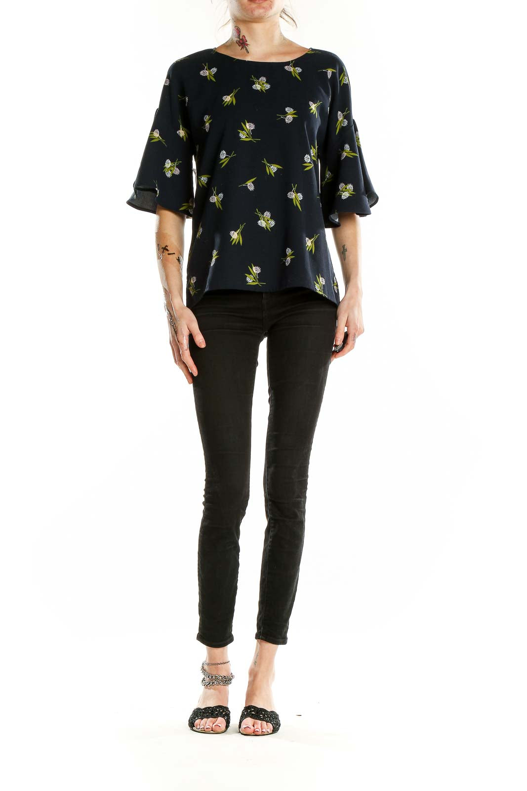 Front view of Ann Taylor black floral print blouse with bell sleeves