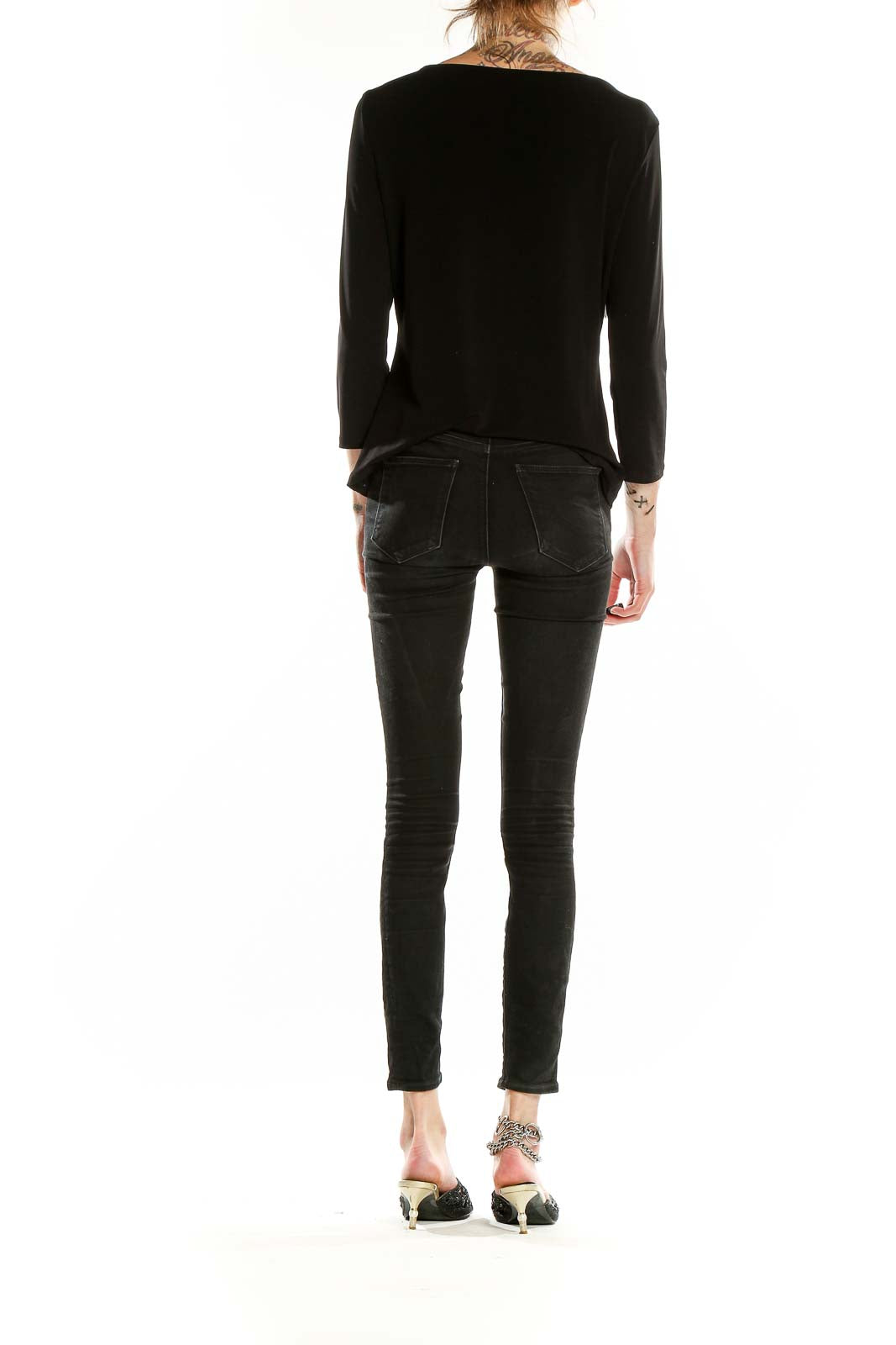 Back view of black Carmen Marc Valvo long sleeve top