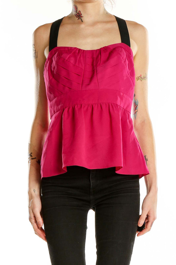 Front view of hot pink Parameter peplum top with sweetheart neckline and black straps