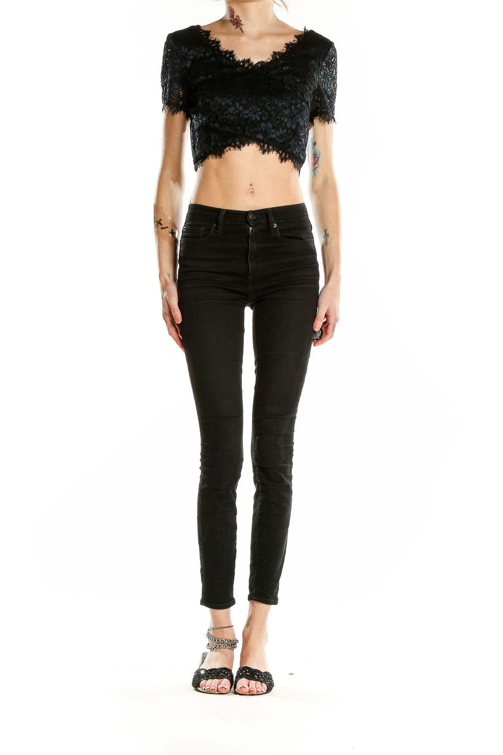 Front view of black lace crop top from Bebe with scalloped V-neckline