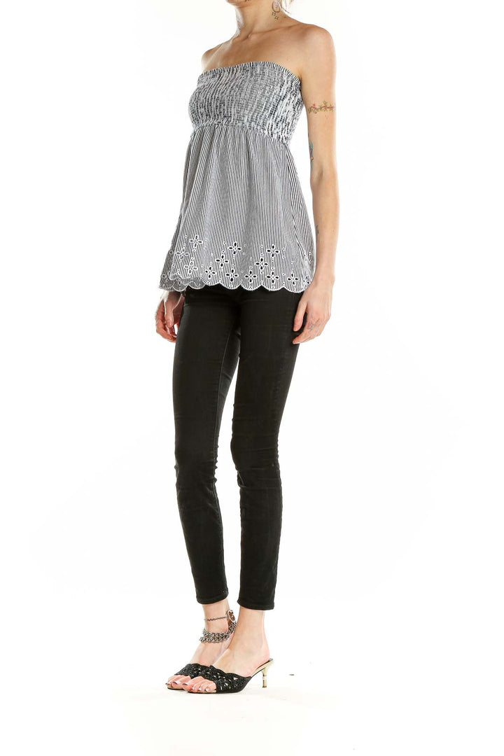 Front view of LOFT gray striped strapless top with eyelet detail