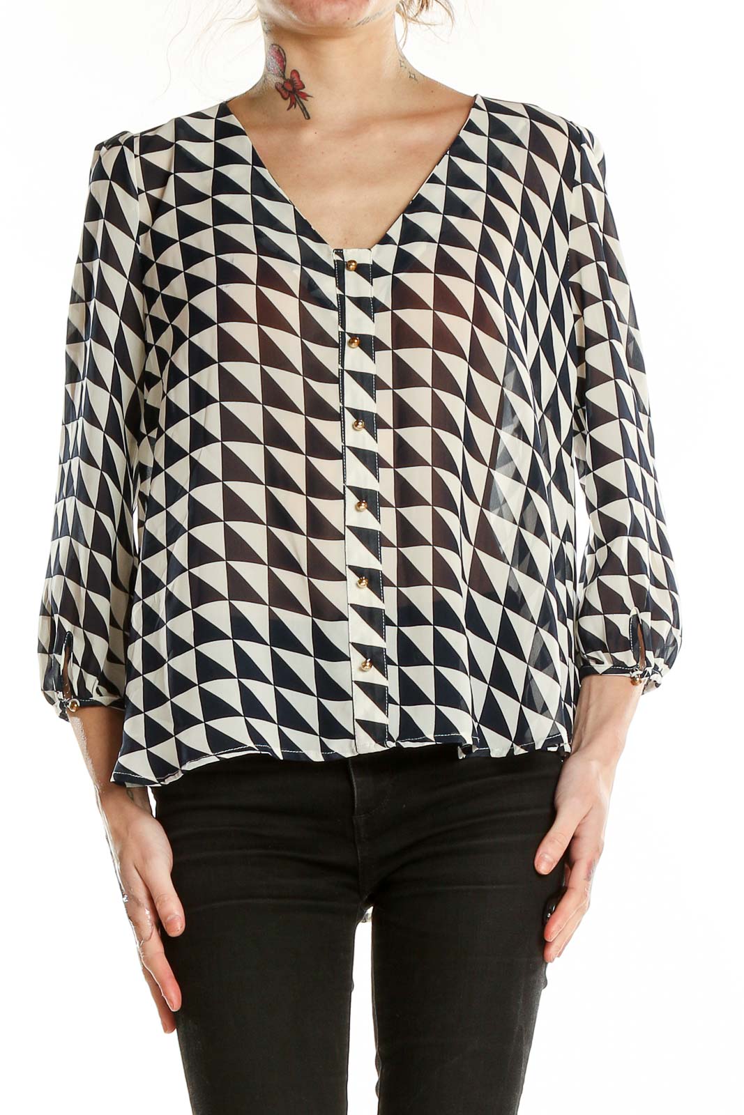 Front view of Lucy Paris black and white geometric print blouse with V-neck and button-front closure