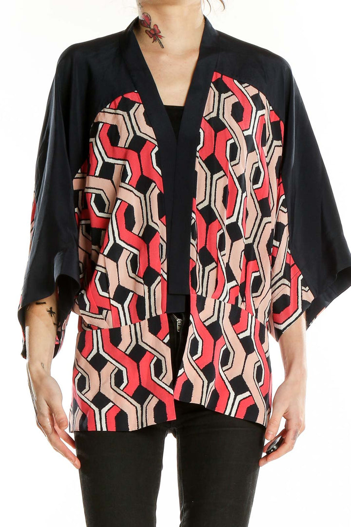 Front view of Trina Turk black, red, and beige geometric print silk kimono top