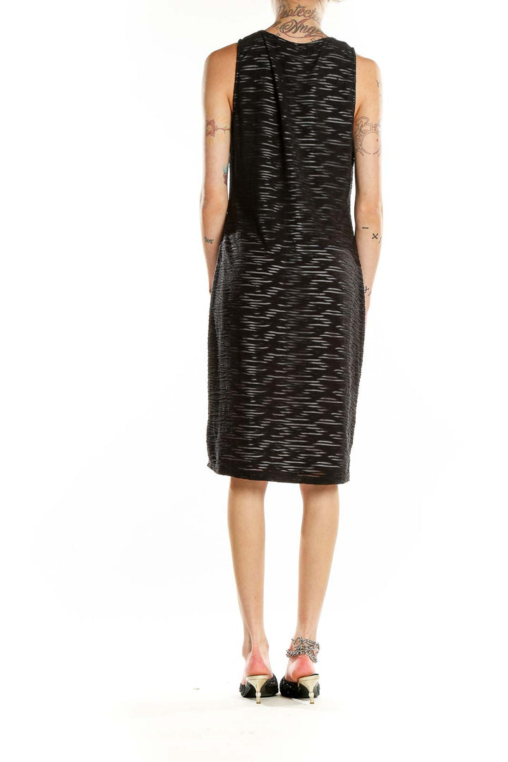 Back view of MARC NEW YORK ANDREW MARC black textured sleeveless midi dress