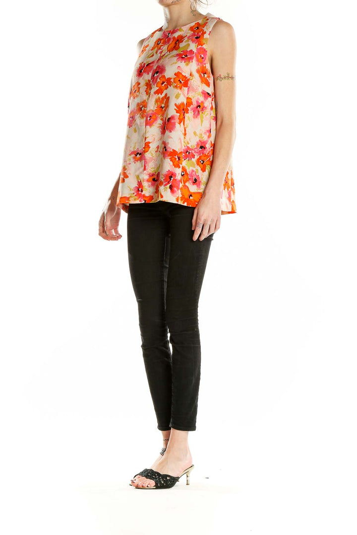 Front view of LOFT orange floral sleeveless blouse on model