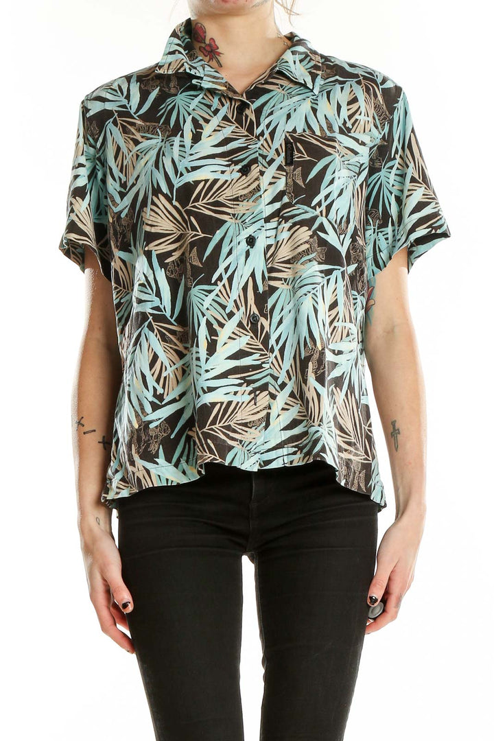 Front view of Columbia teal tropical print short-sleeve button-up shirt