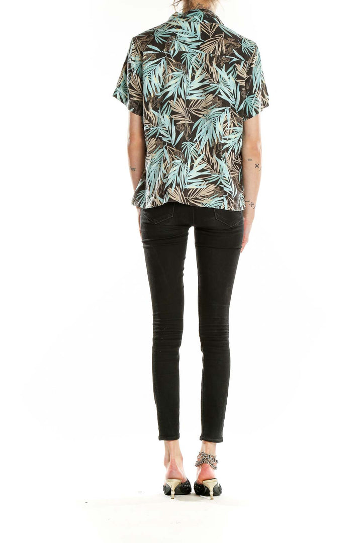 Back view of Columbia teal tropical print short-sleeve button-up shirt