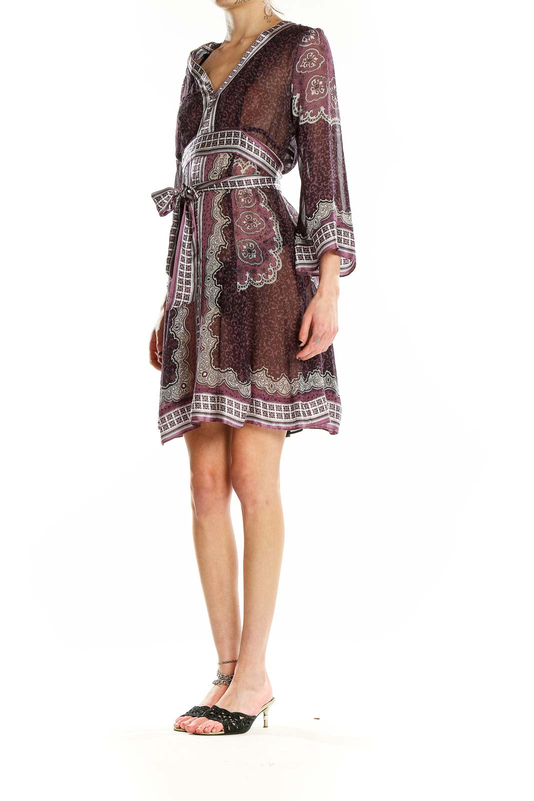 Front view of burgundy paisley print wrap dress with V-neckline and bell sleeves