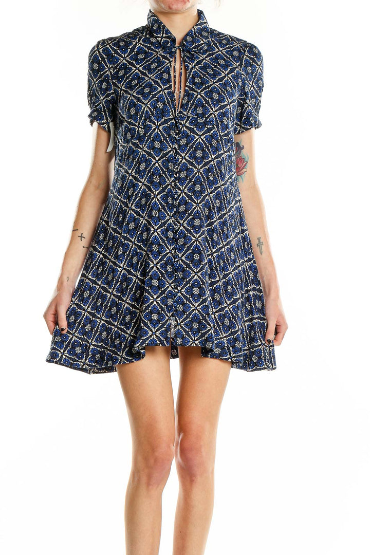 Front view of Free People navy mini dress with geometric floral print