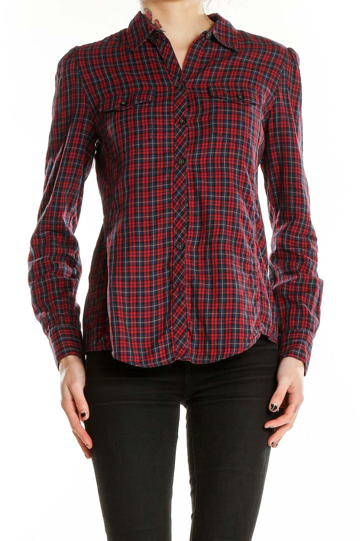 Front view of Banana Republic red plaid button-up shirt on model