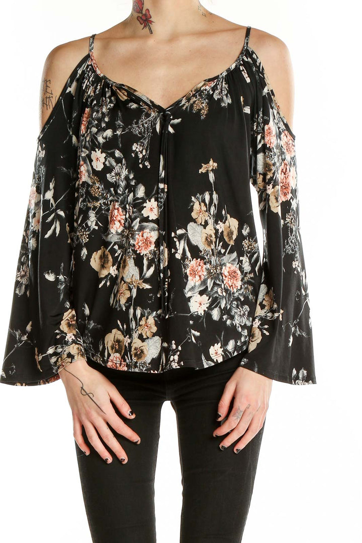 Front view of Veronicam black floral cold shoulder blouse with bell sleeves