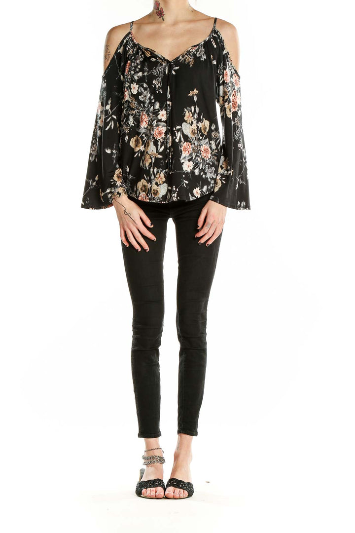 Front view of Veronicam black floral cold shoulder blouse with bell sleeves