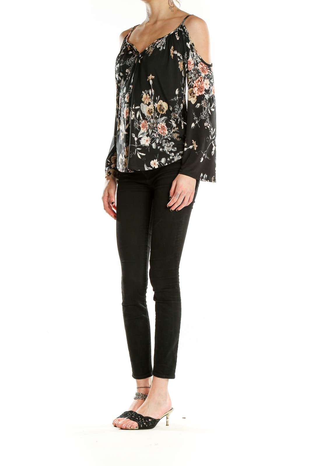 Front view of Veronicam black floral cold shoulder blouse with bell sleeves