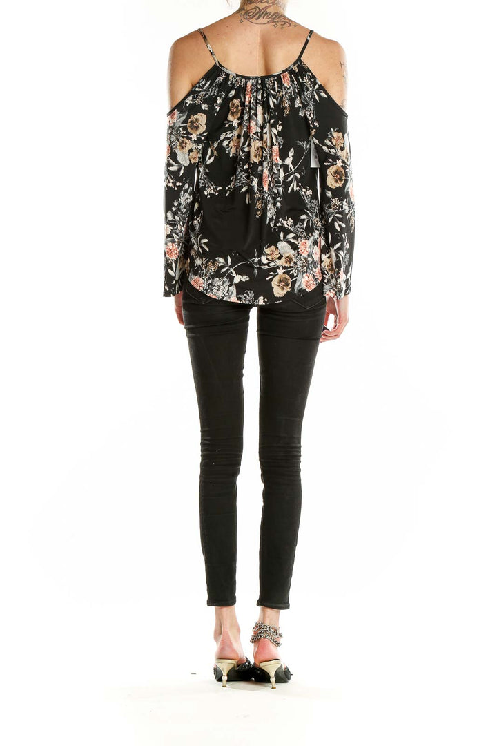 Back view of Veronicam black floral cold shoulder blouse showing gathered neckline