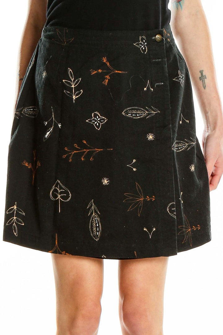 Front view of Talbots black A-line skirt with floral embroidery