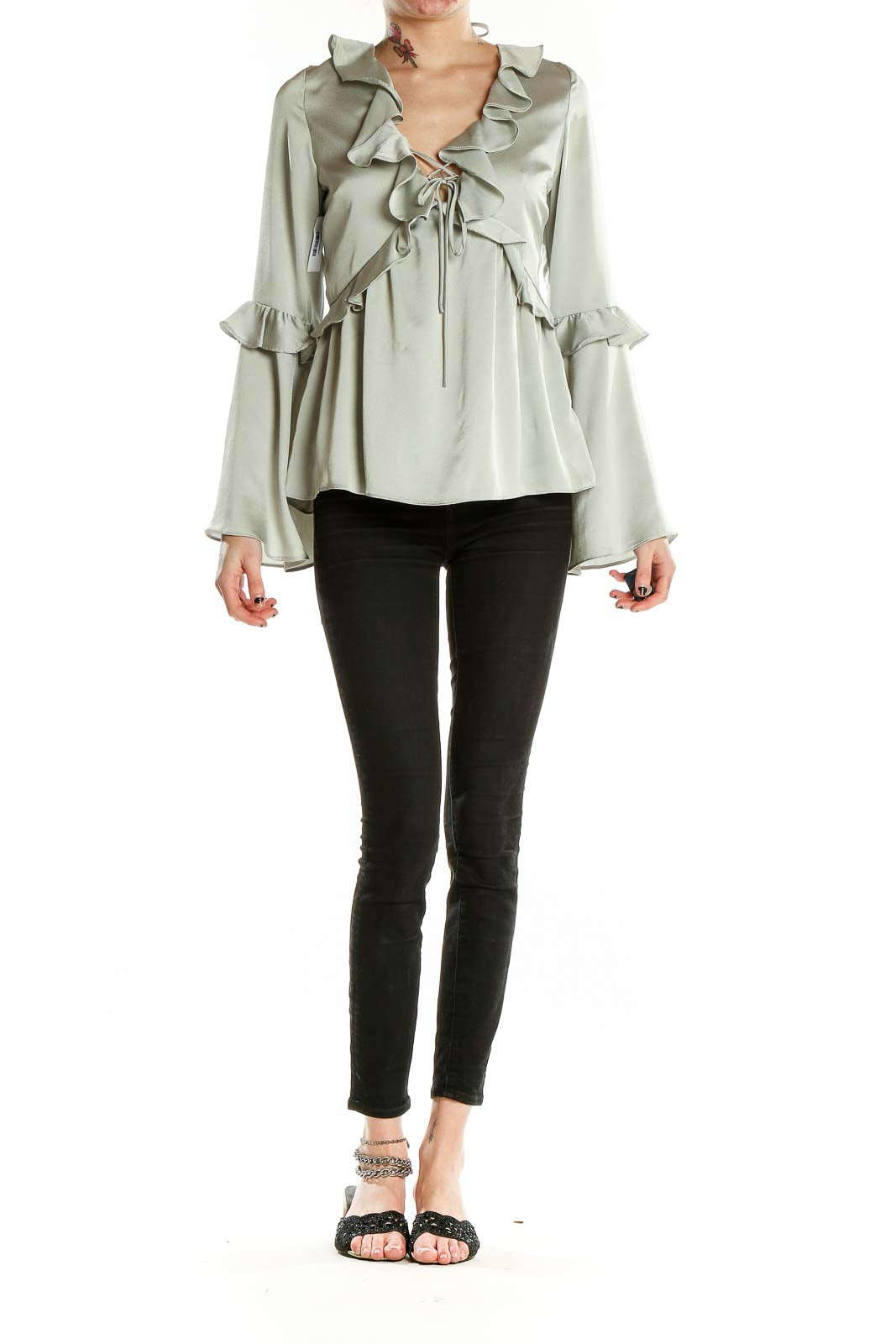 Front view of sage Molly Green blouse with ruffled V-neck and bell sleeves