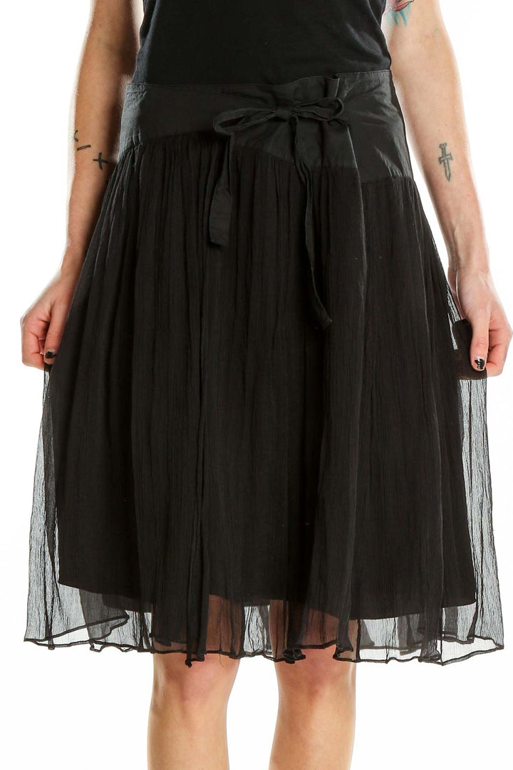 Front view of BCBG MaxAzria black silk tulle midi skirt with bow-tie detail