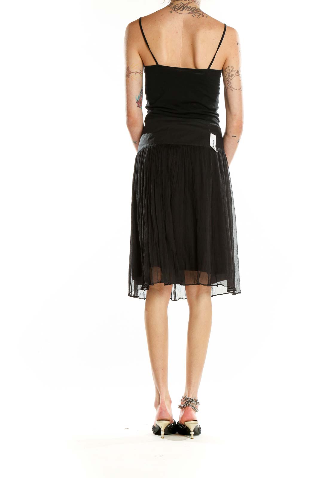 Back view of BCBG MaxAzria black silk tulle midi skirt on model