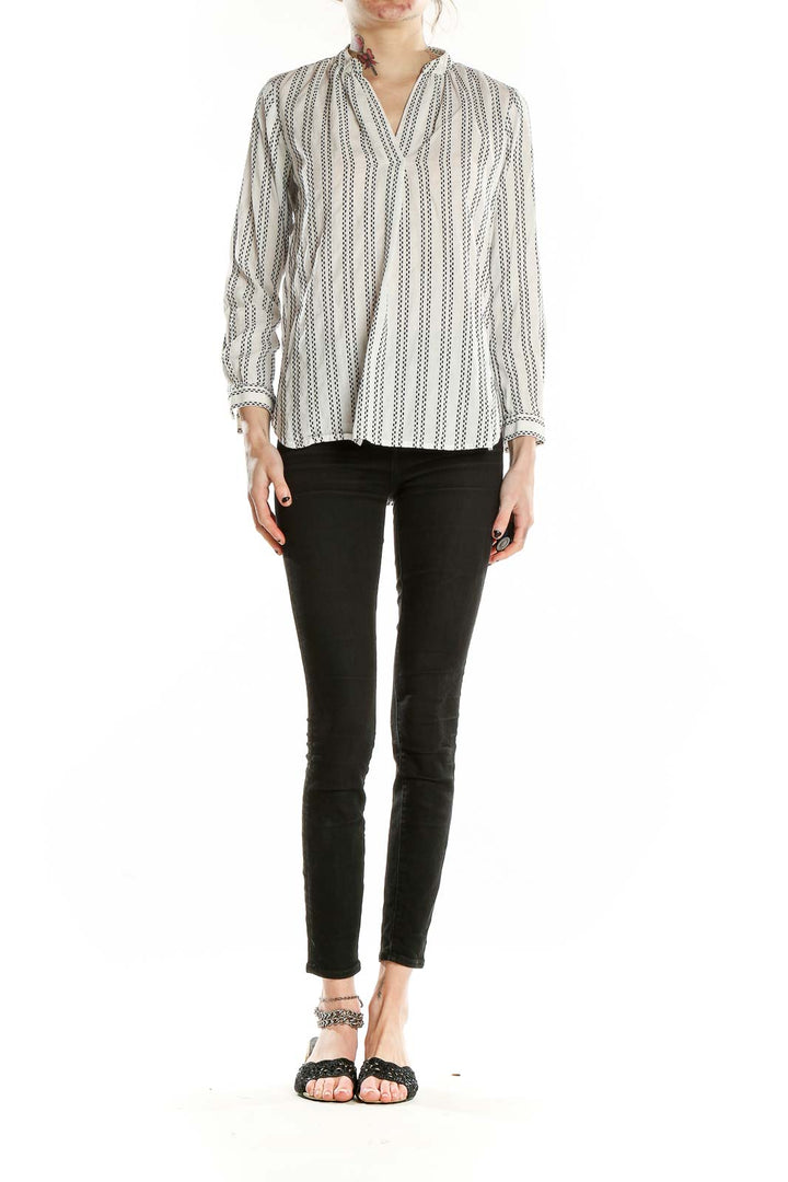 Front view of LOFT white striped V-neck blouse on model