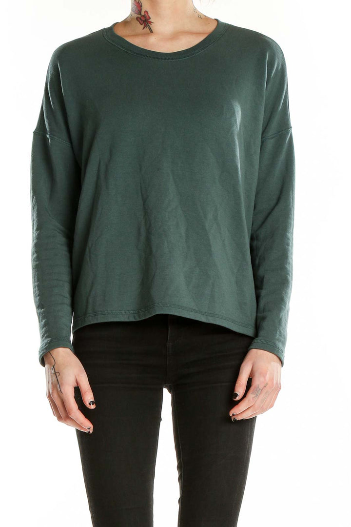 Front view of Madewell forest green relaxed fit long sleeve top