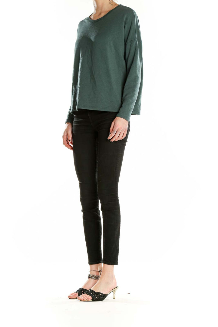 Front view of Madewell forest green relaxed fit long sleeve top