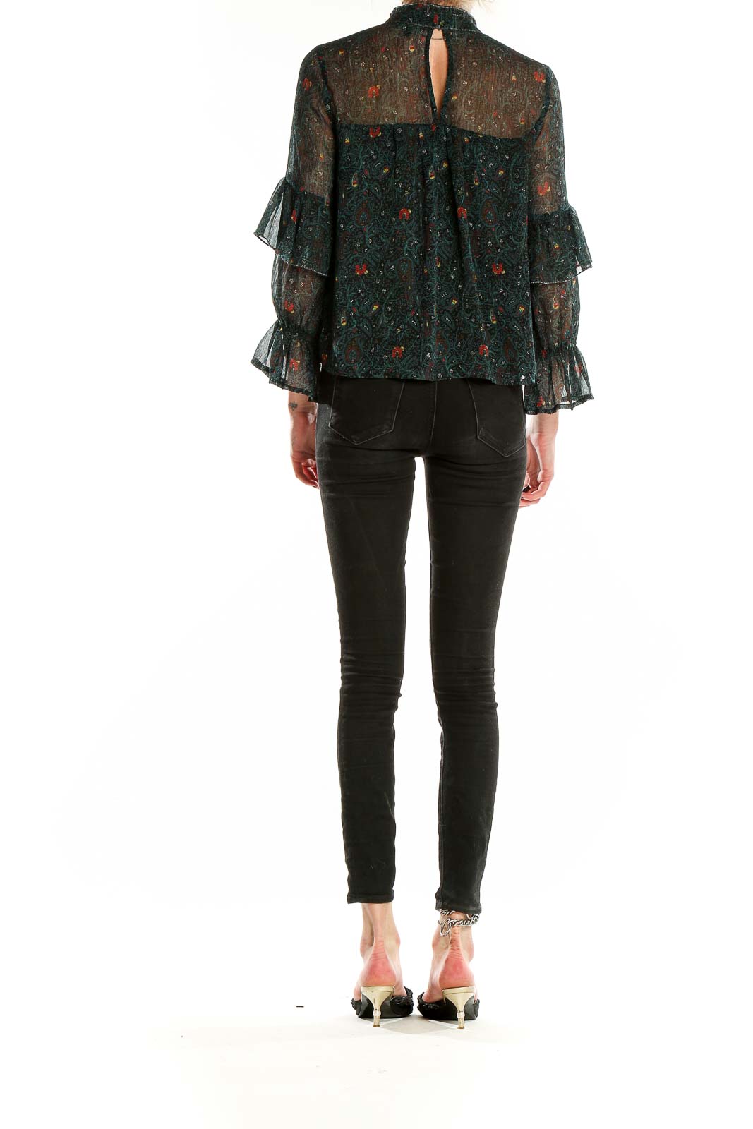 Back view of Lucky Brand dark green sheer blouse showing floral pattern and ruffled sleeves