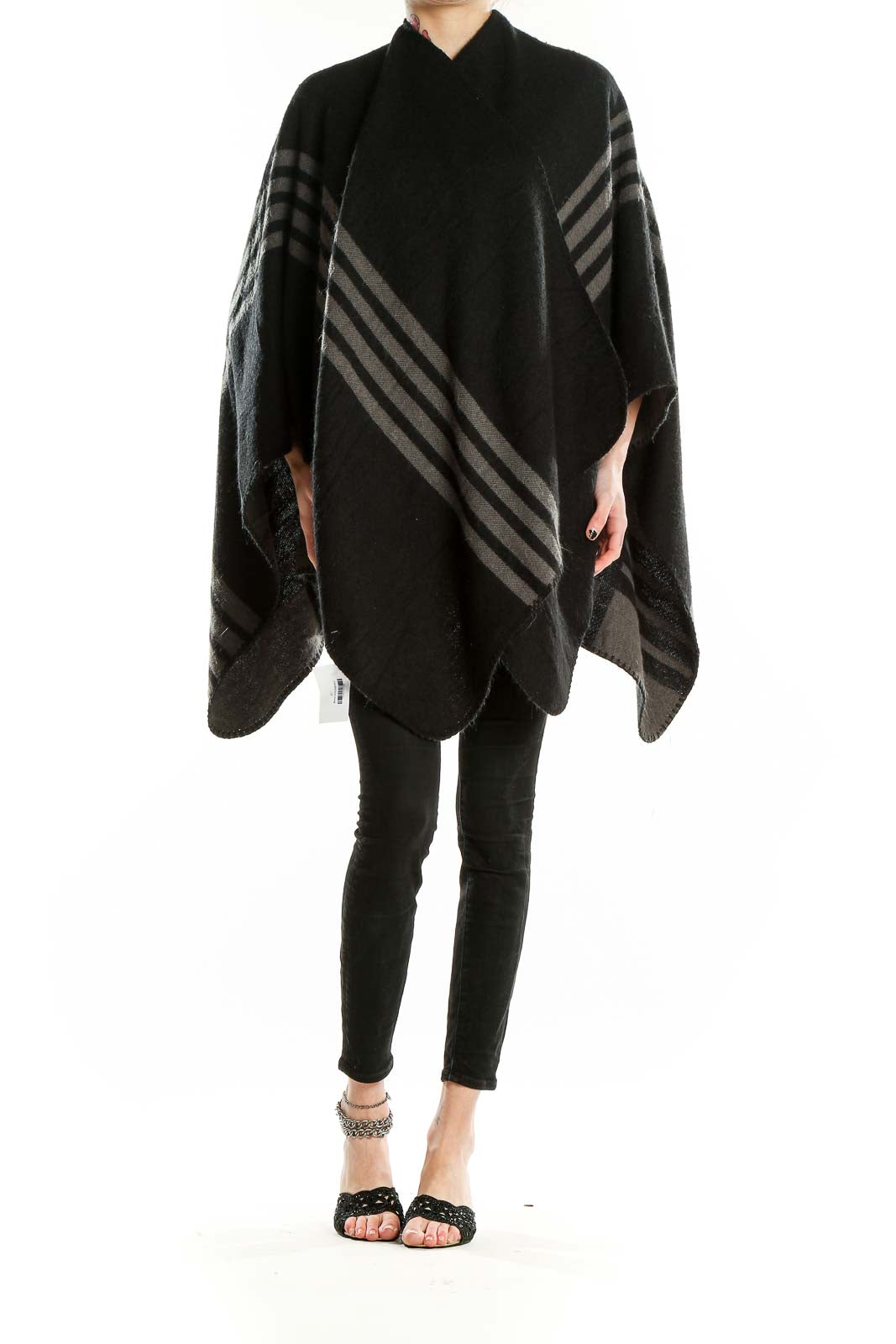 Front view of BB Dakota Black Striped Knit Poncho on model