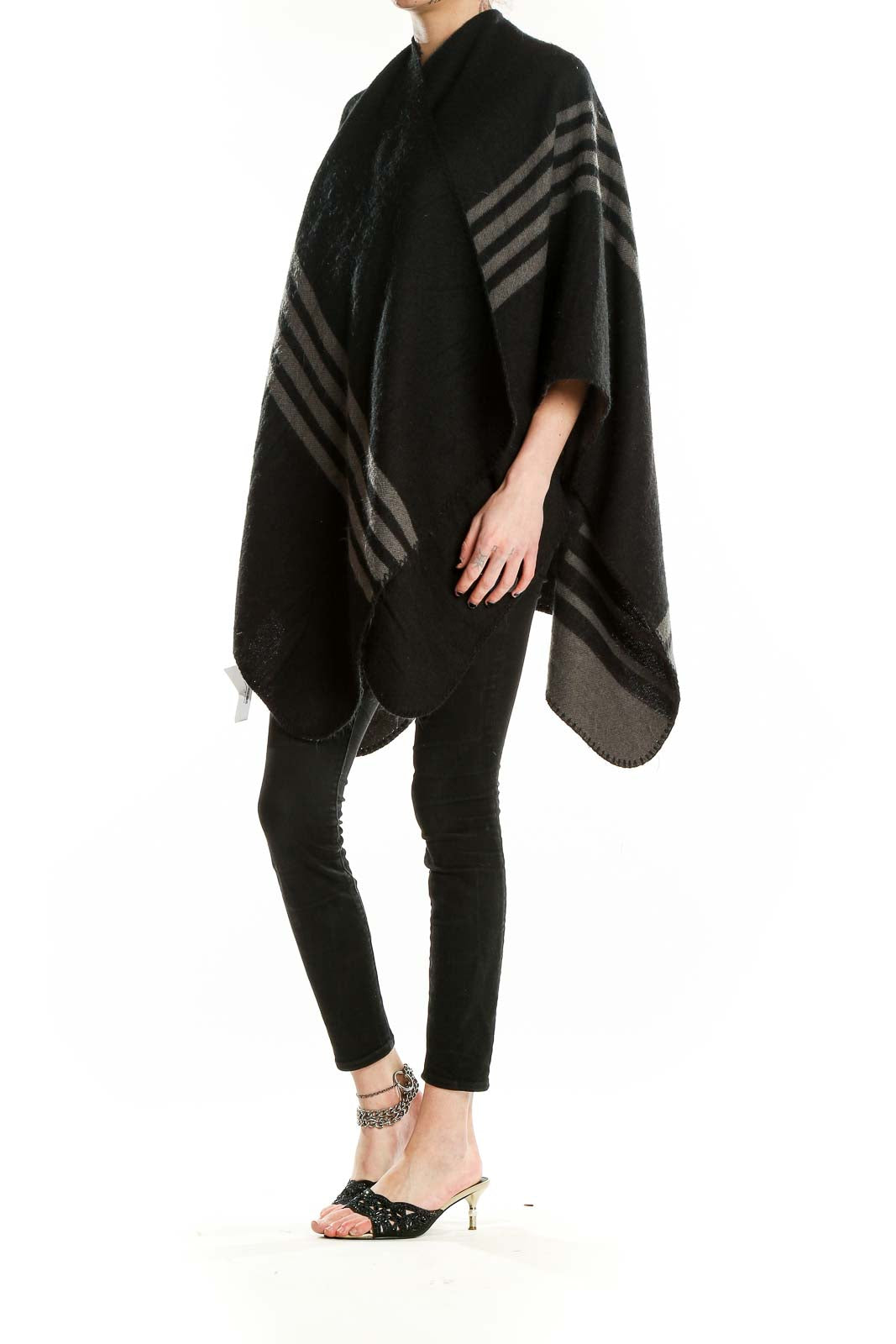 Front view of BB Dakota Black Striped Knit Poncho on model