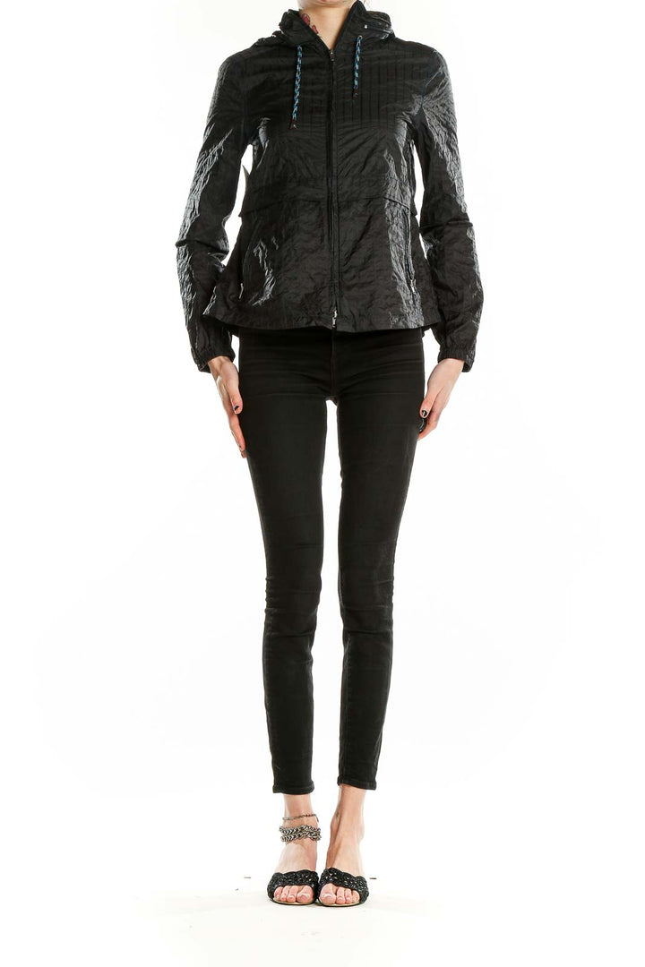 Front view of Free People black quilted nylon jacket with hood