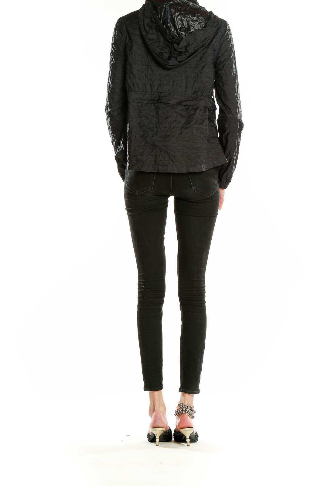 Back view of Free People black quilted nylon jacket showing hood and fit