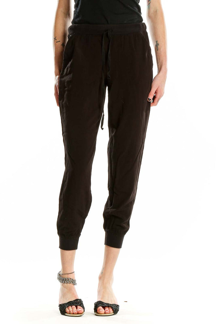 Front view of black cropped jogger pants by M.J.J.P.