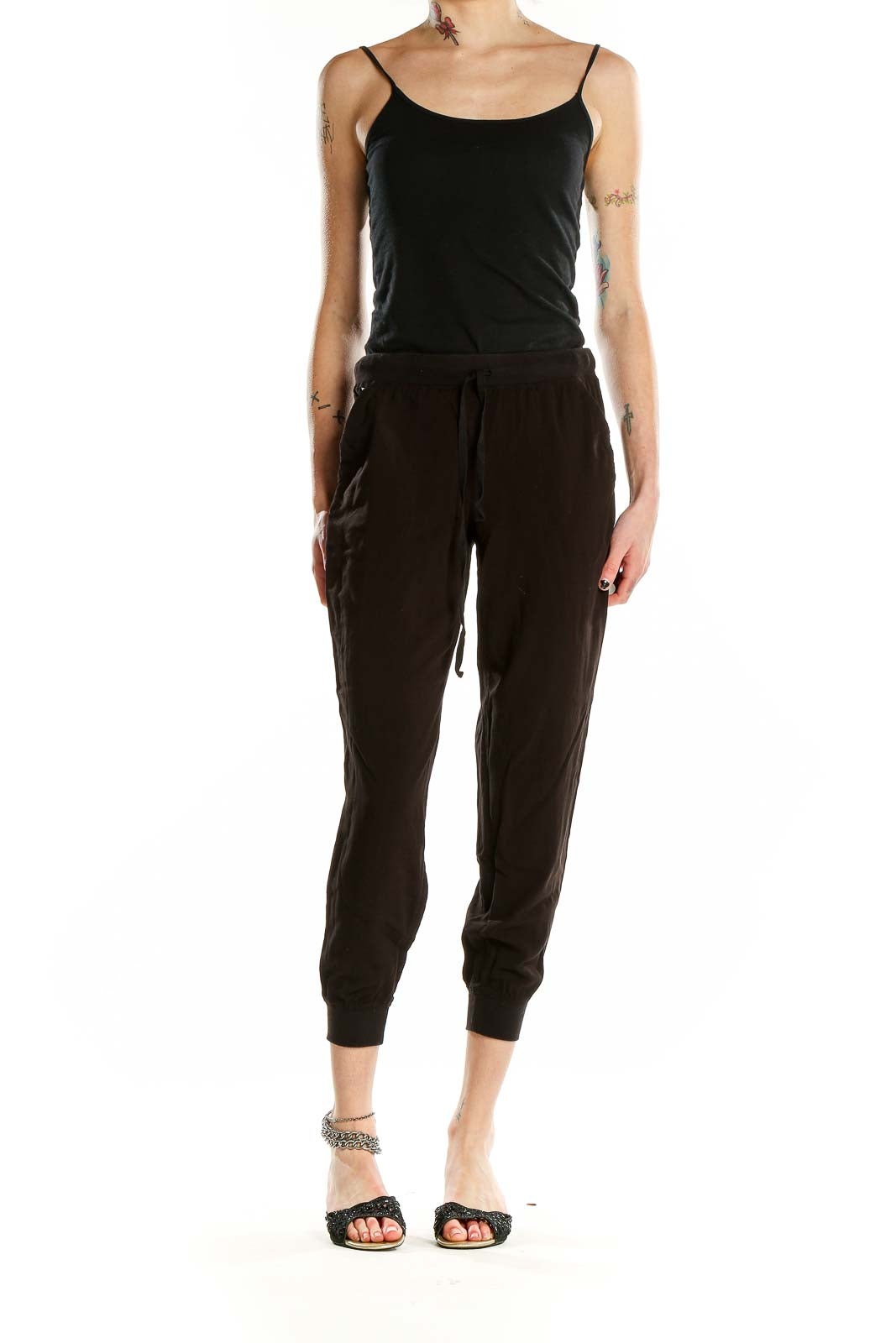 Front view of black cropped jogger pants by M.J.J.P.