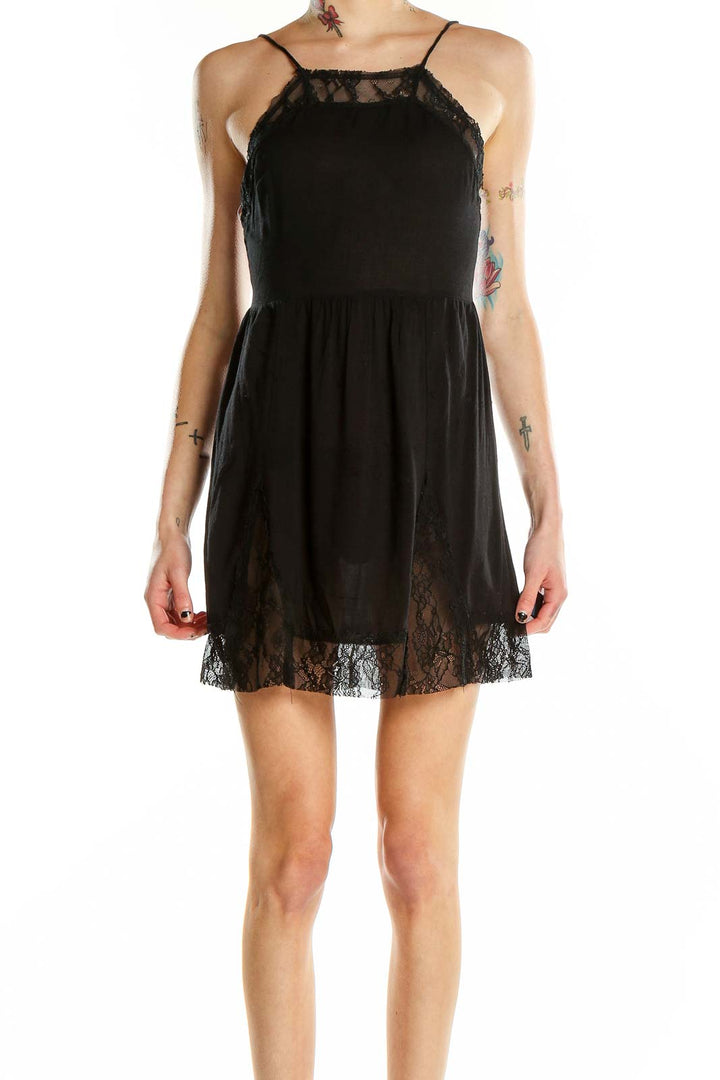 Front view of black lace-trimmed mini dress by Intimately Free People